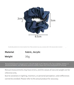 Detail view of the 8.5cm blue denim fabric hair claw clip with size dimensions and weight