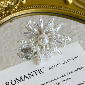 Detailed macro view of elegant pearl flower charms for DIY shoe buckle decoration