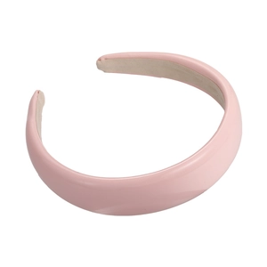 Pink glossy patent leather sponge headband with wide padded design on white background