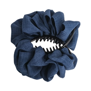 Deep blue denim fabric pleated hair claw clip for voluminous bun hairstyles on white background