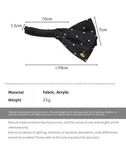 Detailed view of black polka dot satin banana clip with dimensions 19cm by 10cm