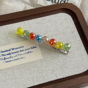 Detailed macro of vintage Korean style hairpin with colorful multi-faceted crystals