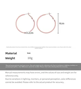Detail of pink 4cm iron hoop earrings showing precise thickness and lightweight 10g design