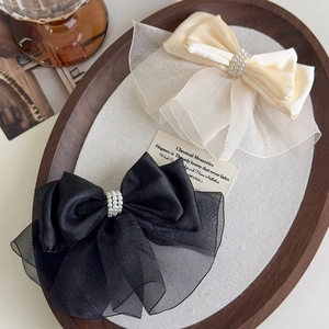 Elegant satin and organza bow hair clips with pearls in black and cream white colors