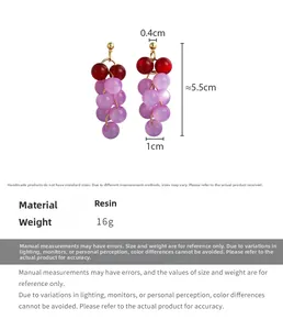 Detail view of grape-shaped beaded earrings with resin beads and dimensions marking