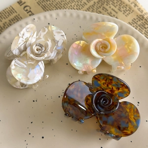 French vintage acetate camellia hair claws in marble, iridescent yellow and tortoiseshell