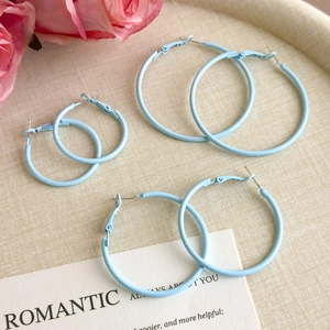 Three pairs of matte light blue round hoop earrings in small, medium, and large sizes