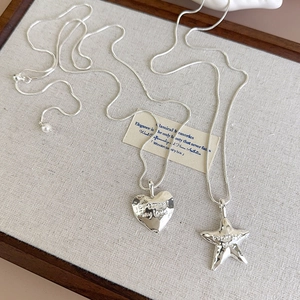 Silver snake chain necklace set with textured heart and star pendants for women