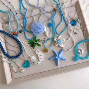Perlenhalskette und Armband Set mit Seestern Anhängern für den sommerlichen Strandurlaub