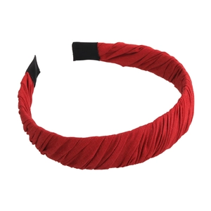 Pleated red fabric headband with anti-slip ends for a stylish and comfortable fit