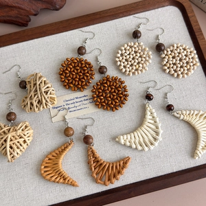 Bohemian handmade woven rattan and wood geometric drop earrings set in natural earth tones