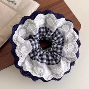 Navy blue checkered scrunchie with white heart embroidery and lace edge details