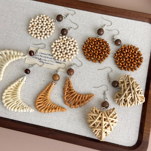 Handmade wooden and woven raffia drop earrings with heart and geometric patterns
