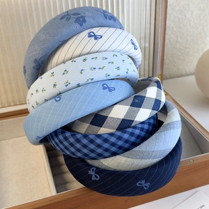 Blue plaid and floral sponge padded headbands collection in a wooden display box