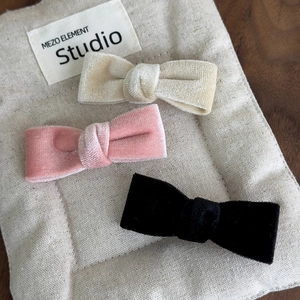 Three-piece velvet bow hair clips set in cream, dusty pink and black colors