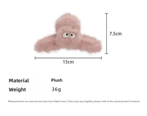 Detailed view of pink plush hair claw clip with cartoon eyes showing 15cm size specs