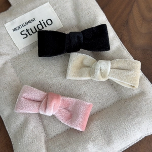 Three-piece velvet bow hair clips in black, beige, and pink colors for women