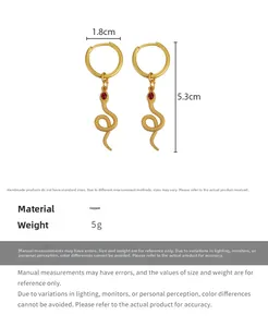 Detailed spec view of matte gold snake earrings with red gems, 1.8cm wide by 5.3cm high