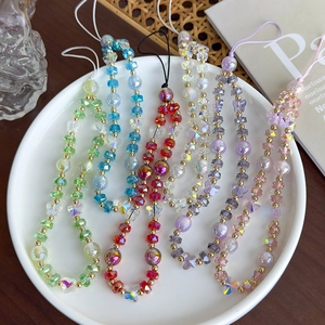 Dragonnes de téléphone en perles papillon colorées en six teintes sur plateau blanc