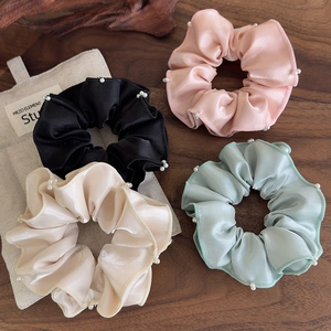 Set of four satin scrunchies with white pearl edge detailing in various elegant colors