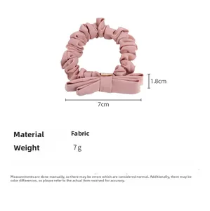 Detailed sizing chart for pink fabric scrunchie with bow showing 7cm diameter and 1.8cm bow