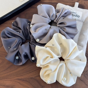 Three-piece satin scrunchies set in grey and beige with faux pearls and metal studs