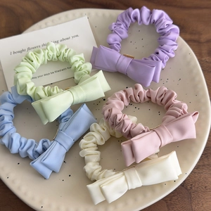 Five-piece set of macaron-colored bow scrunchies in pastel purple, green, blue, pink, and beige
