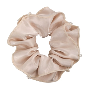 Elegant champagne silk satin scrunchie with ruffled edges and hand-sewn pearls for women