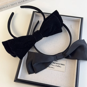 Elegant black velvet and satin bow headband set displayed in a premium jewelry gift box