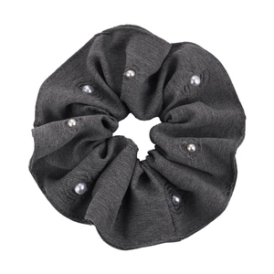 Dark grey fabric scrunchie with white pearl accents and floral texture on white background