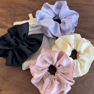 Elegant 4-piece satin scrunchies set in pastel colors for women stylish hair styling