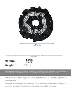 Detail view of large French black polka dot satin scrunchie with lace trim and size specs
