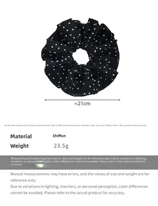 Detail view of extra large black chiffon hair scrunchie with white polka dots