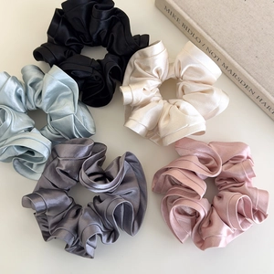 Elegant satin ruffle scrunchies set in five colors with soft pearlescent texture