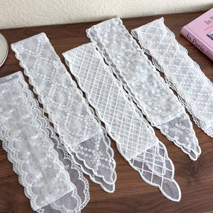 Elegant white lace hair ribbons with floral embroidery and geometric mesh patterns