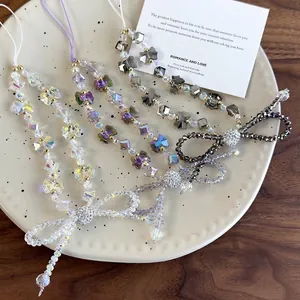 Chic beaded phone wrist strap featuring crystal bow and iridescent beads in four colors