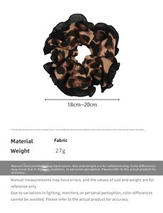Macro detail of leopard print scrunchie with lace edge showing 18-20cm size measurement