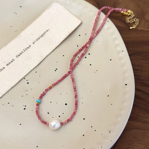 French romantic style necklace featuring pink stone beads and a white baroque pearl