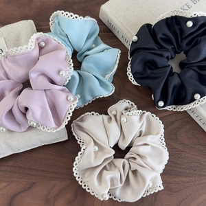 Elegant satin hair scrunchies with white lace trim and pearl accents in four soft colors