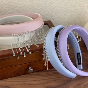 Set of four satin padded headbands with sparkling silver rhinestone tassels in soft pastel colors