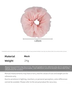 Detail view of pink mesh lace oversized scrunchie showing 20cm diameter and soft texture