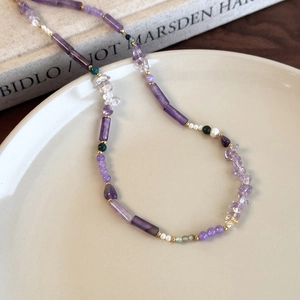 Handmade necklace featuring dark purple amethyst beads, pearls and golden metallic spacers