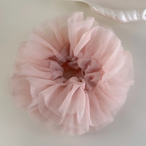 Oversized pink lace scrunchie with layered tulle ruffles for ballet style ponytail
