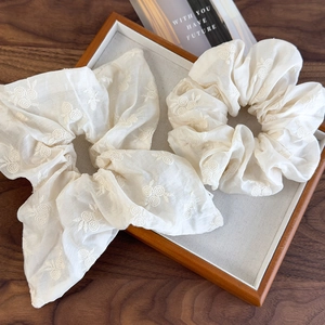 2Pcs cream beige floral embroidered fabric scrunchies in a rustic wooden display tray