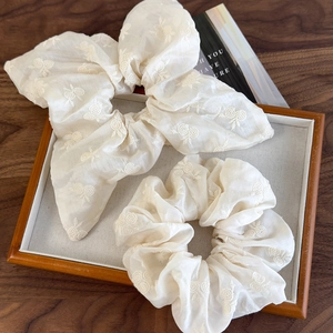 Elegant cream floral embroidered scrunchies set with a long ribbon bow for hair styling