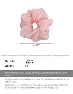 Detail showing oversized 18cm pink organza scrunchie with soft mesh fabric texture