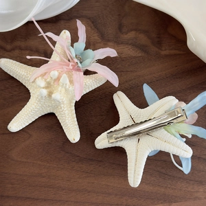 Detail of starfish hair clips with faux flowers and silver metal alligator clip set