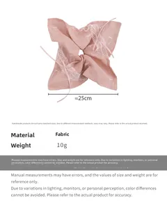 Detailed view of pink ribbon bow hair tie with lace trim and 25cm size dimensions