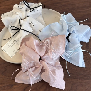 Floral ballet bow hair scrunchies with lace trim and ribbons in a pastoral style