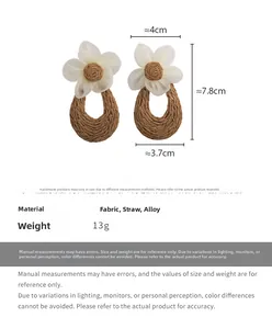 Detailed size chart showing white fabric flower earrings with brown straw woven drops